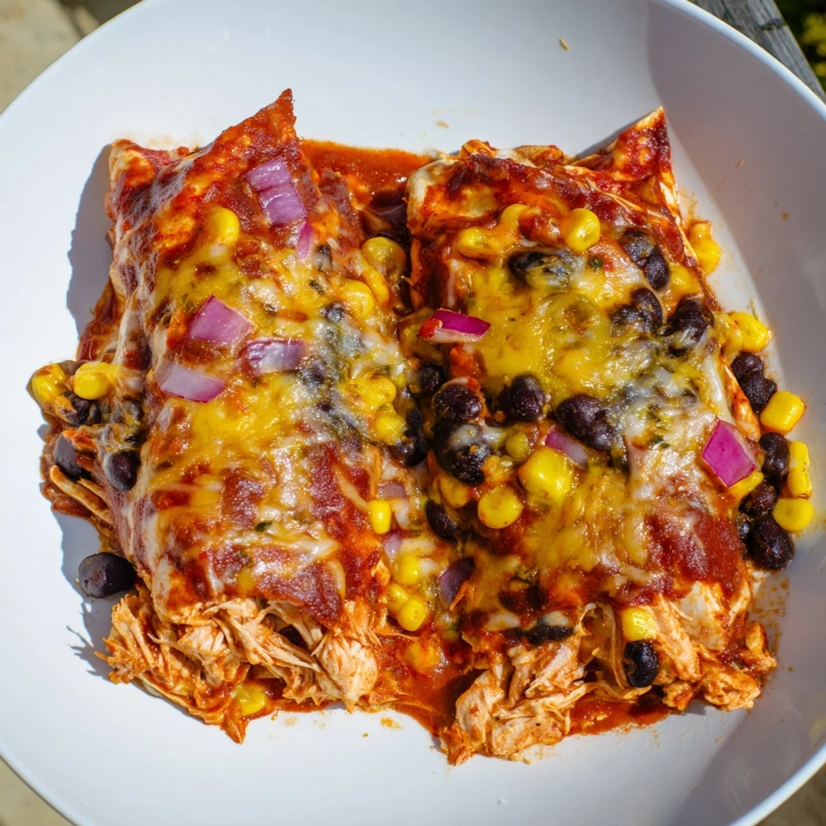 Warm and flavorful: steaming Chicken Enchilada Casserole with a taste of Tex-Mex comfort food.