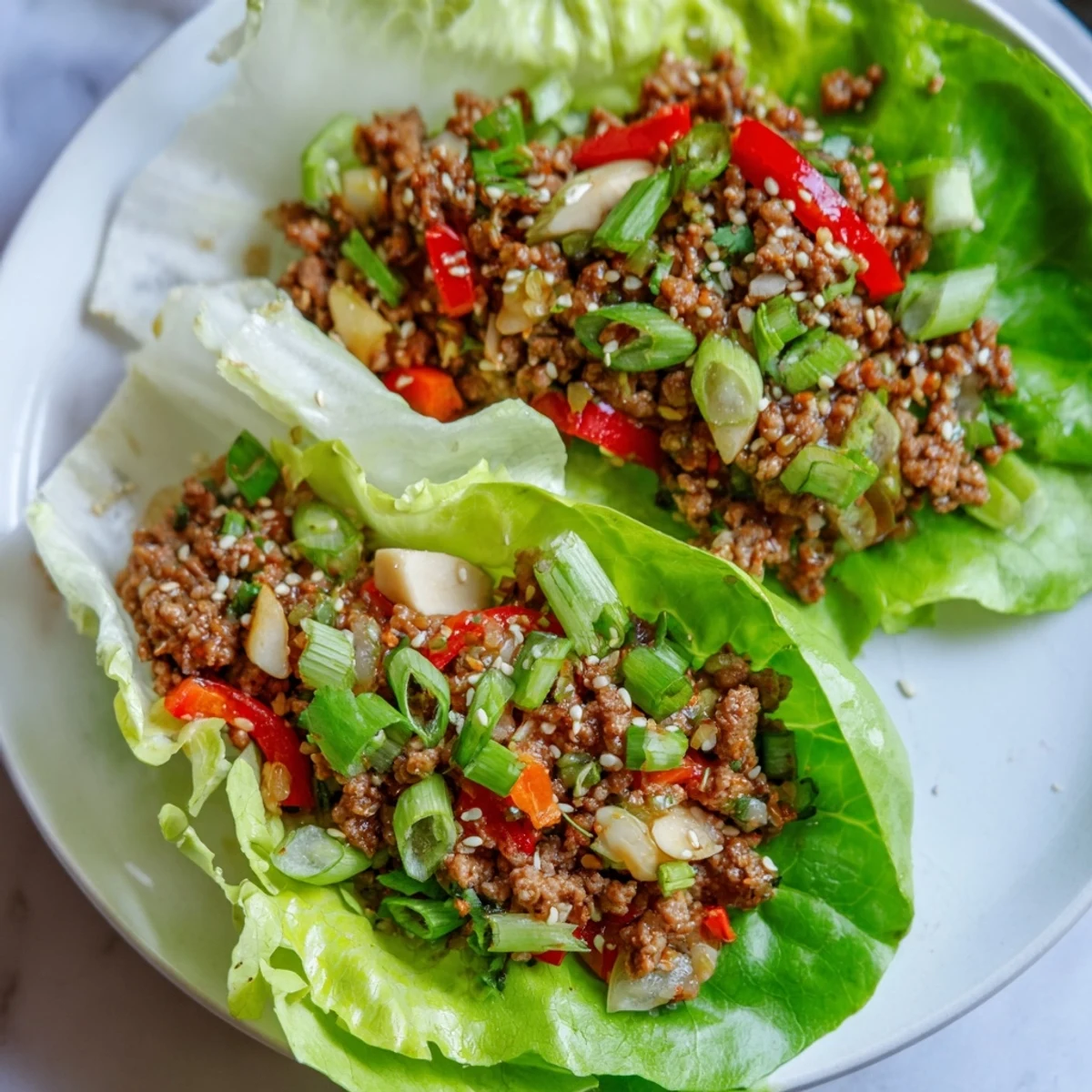 Golden-brown Beef Lettuce Wraps filled with savory meat and fresh, crunchy vegetables.