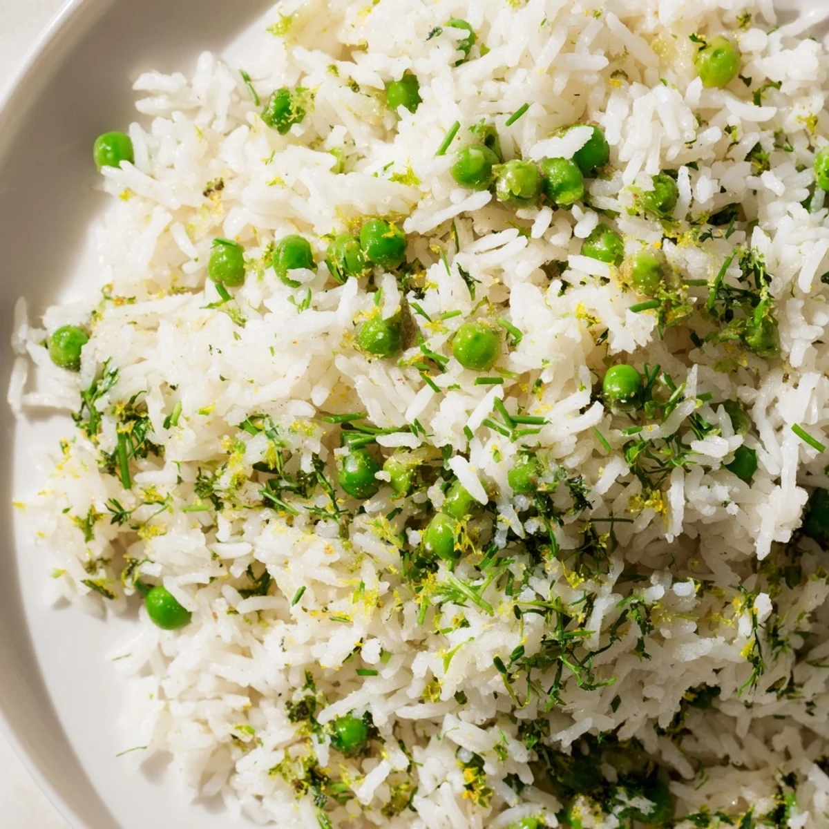 Freshly chopped parsley, dill, and chives garnish the warm Lemon Herb Rice Pilaf.