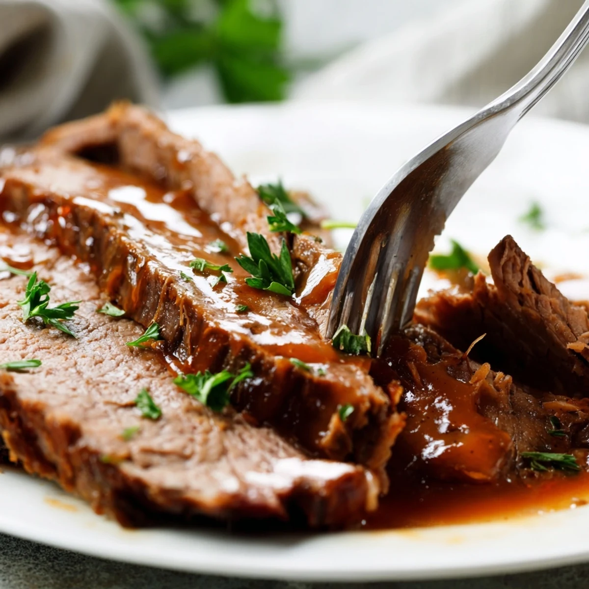 Hearty Slow Cooker Beef Brisket layered on a sandwich with crisp pickles and smoky barbecue sauce drizzle.