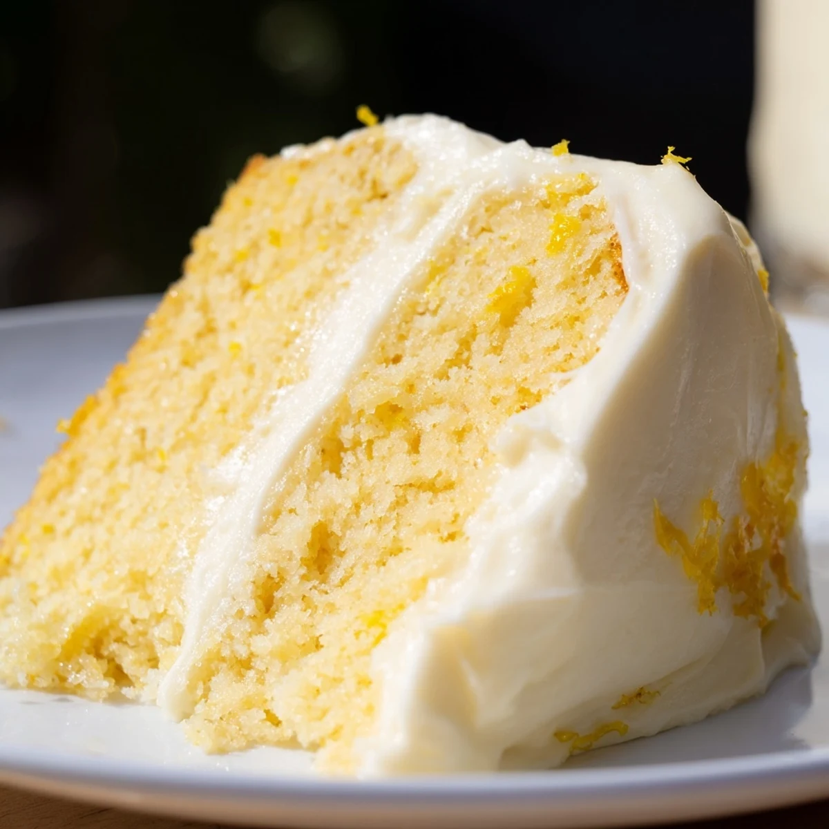 A single serving of Lemon Cake with Frosting has fluffy texture and tangy lemon zest.
