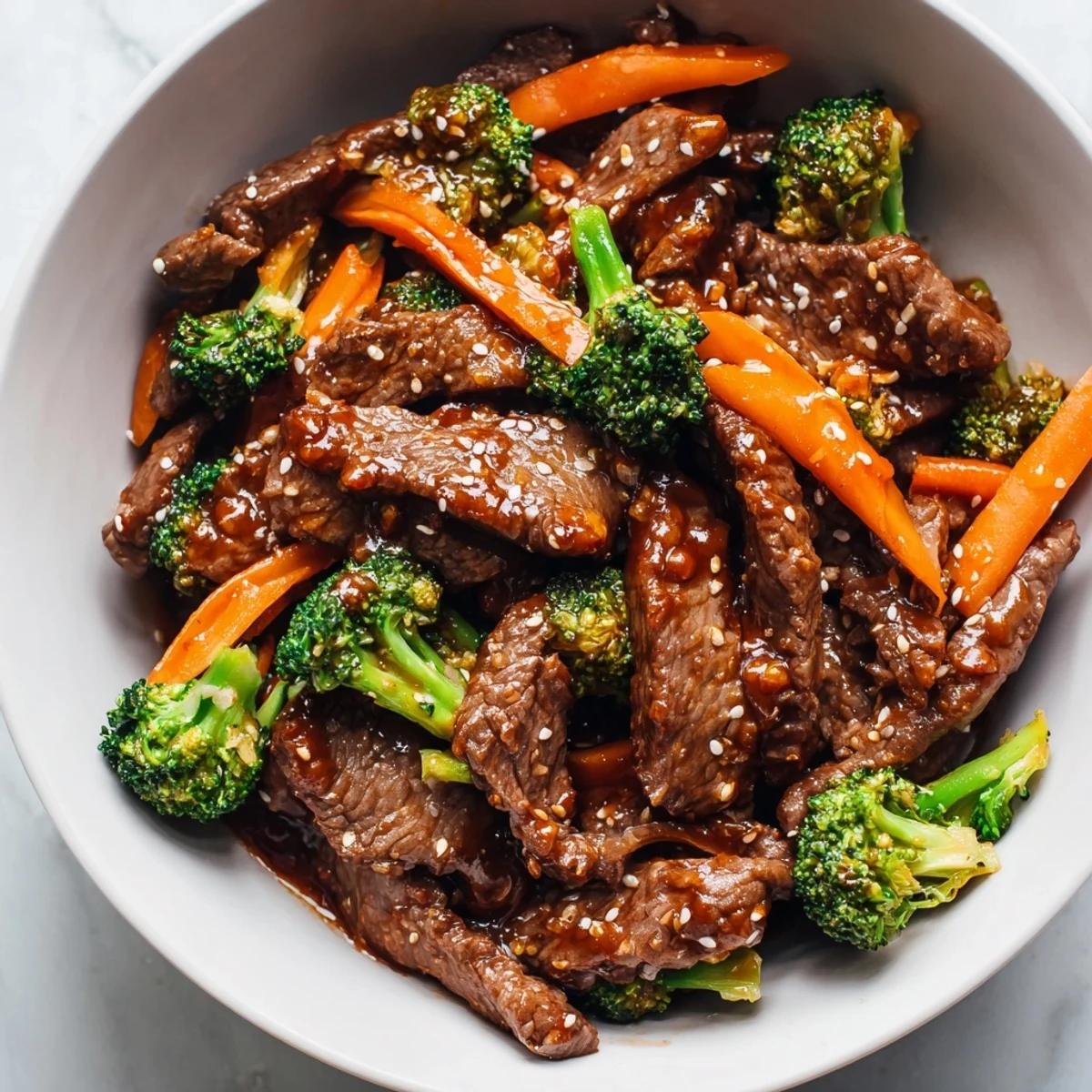 Close-up of a vibrant Spicy Beef Dish Bowl, showcasing juicy beef strips and colorful vegetables tossed in a spicy sauce.