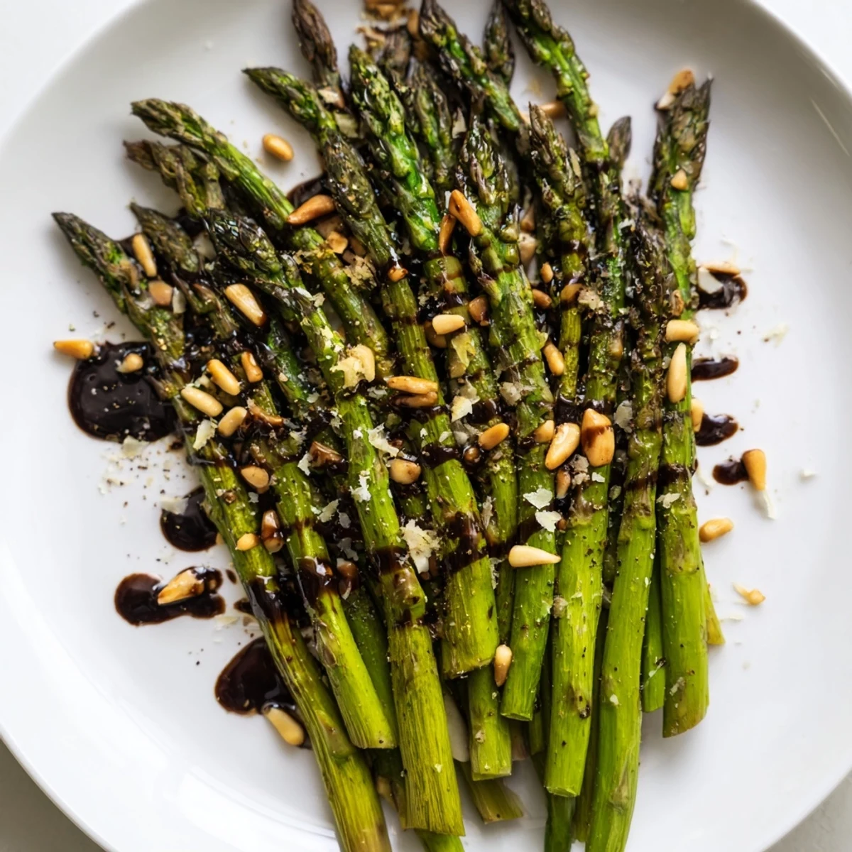 Side dish photo of roasted asparagus with balsamic reduction for dinner.