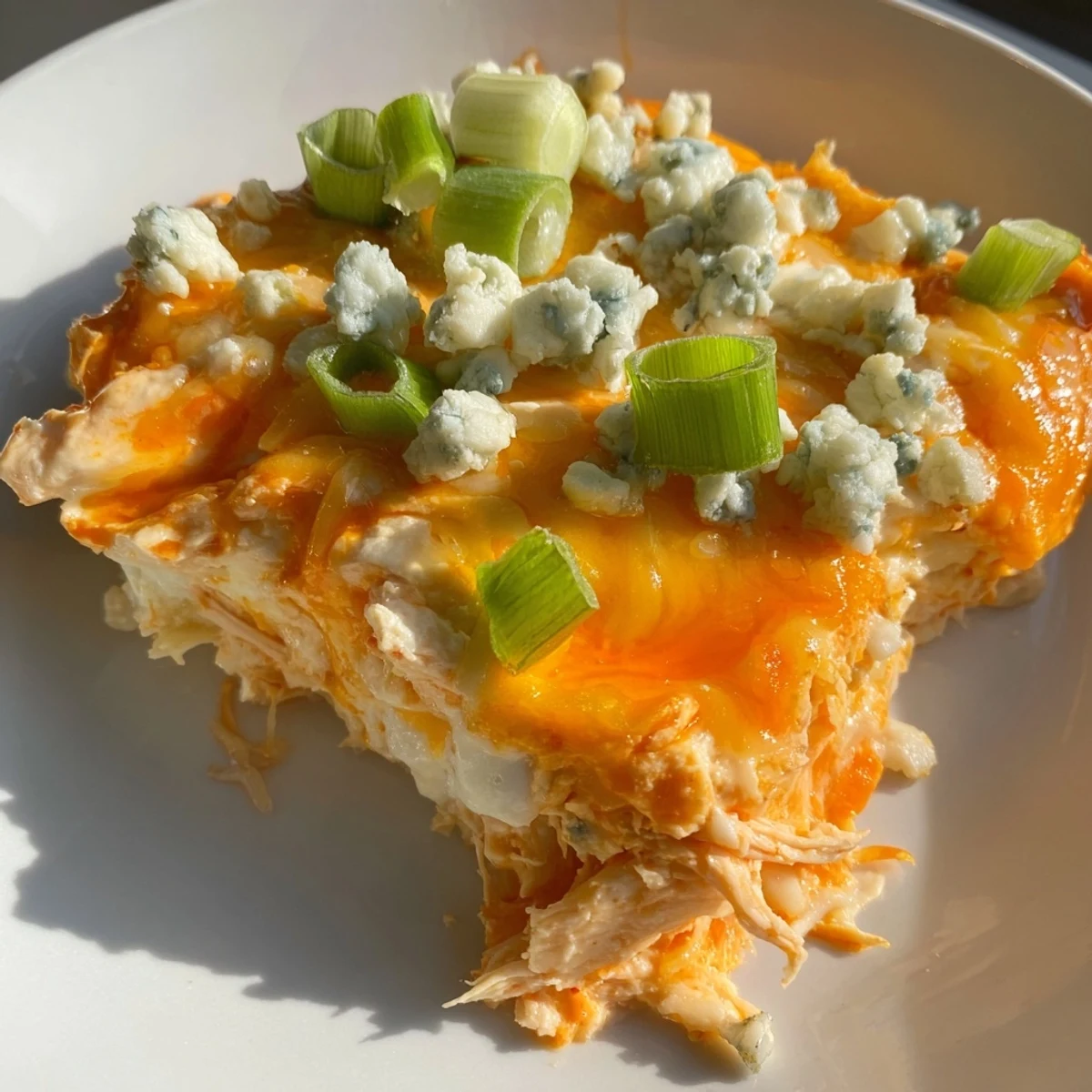 Creamy Keto Buffalo Chicken Dip served warm with celery sticks and keto-friendly crackers.