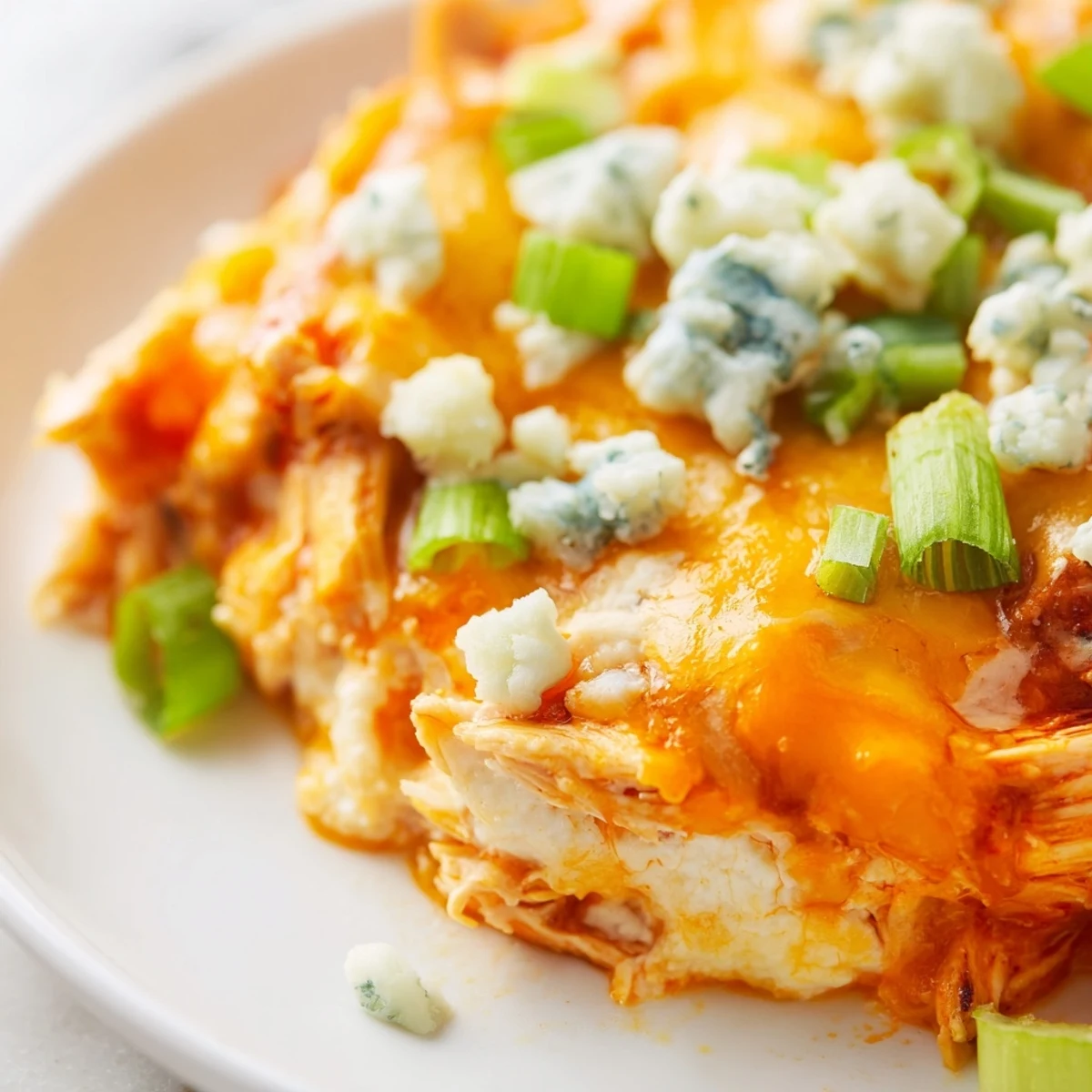 Spicy shredded chicken and melted cheese combine in a rich golden baked dip.