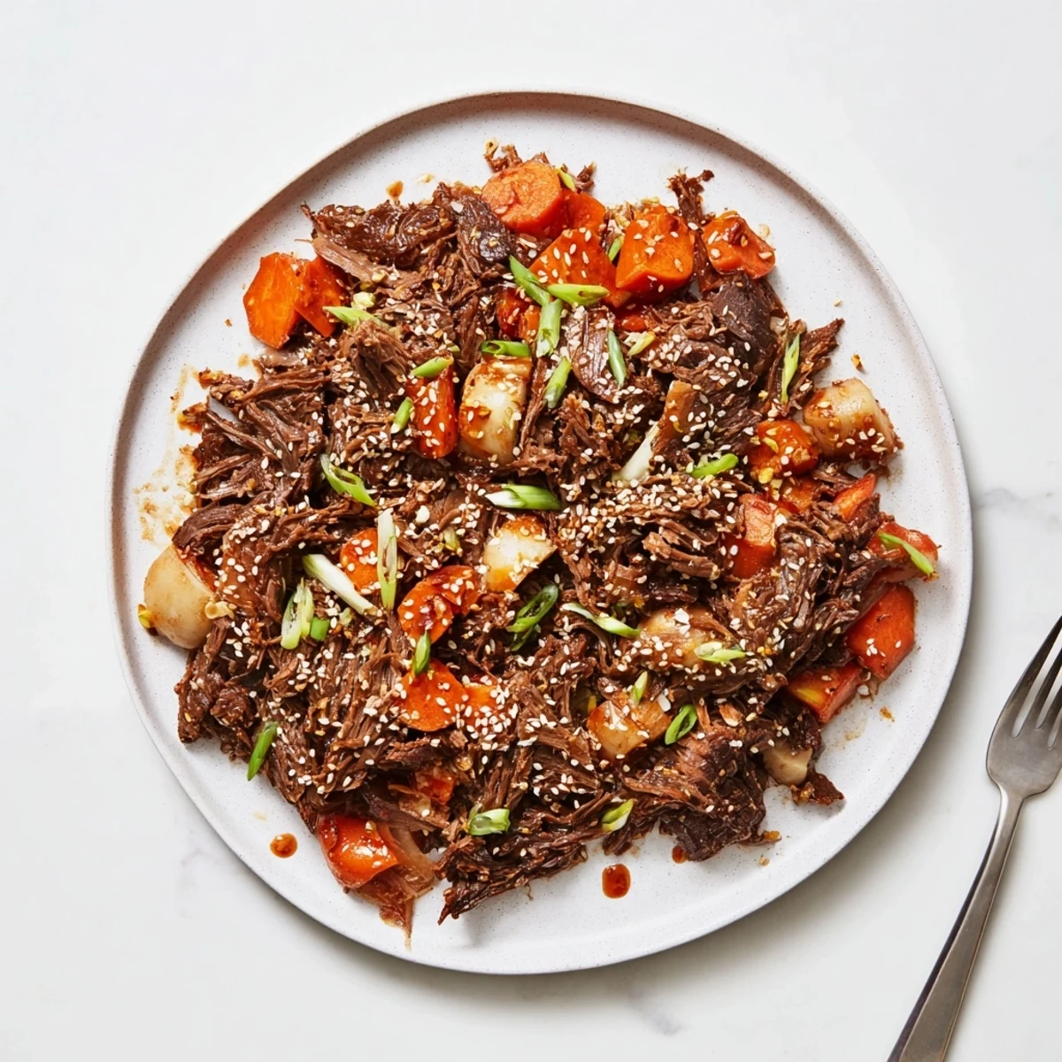 Korean Style Pot Roast simmering in a rich, glossy sauce with tender carrots and daikon in a Dutch oven.
