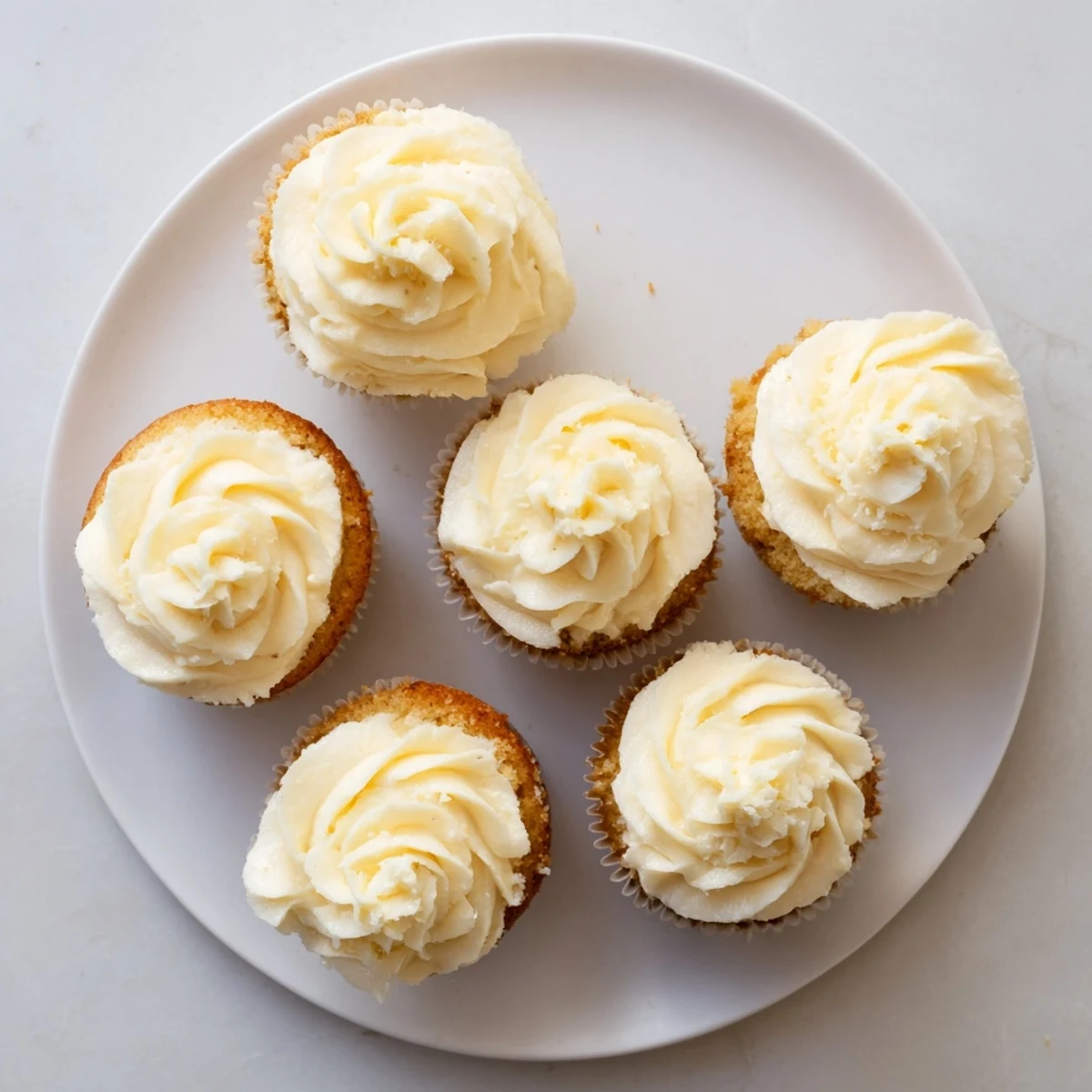 Light and fluffy vanilla cupcakes piped with creamy buttercream frosting, perfect for birthdays and celebrations