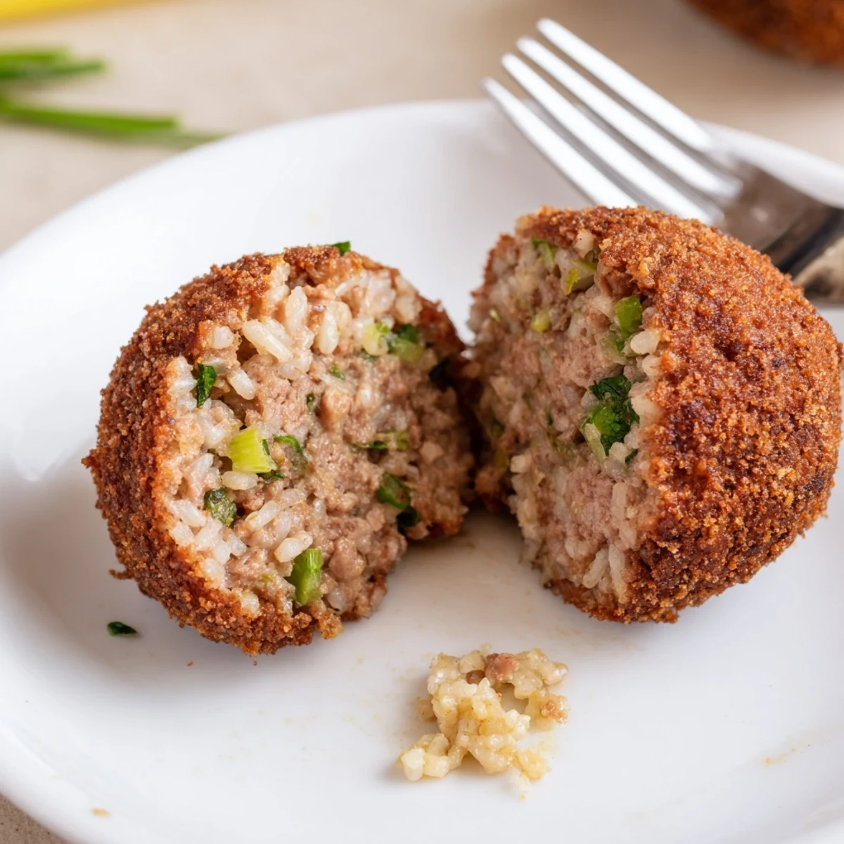 Cajun Boudin Balls: golden crispy exterior, spiced pork rice filling, served hot