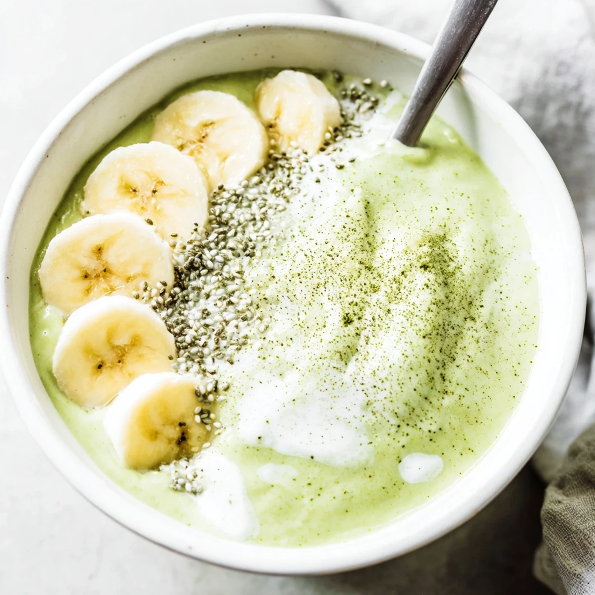 Energizing Matcha Smoothie blended with banana, maple, ice — breakfast pick-me-up