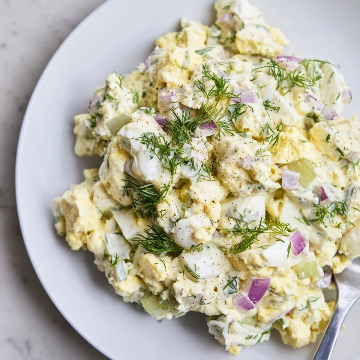 Classic Egg Salad Recipe: creamy, tangy filling on toasted bread with paprika
