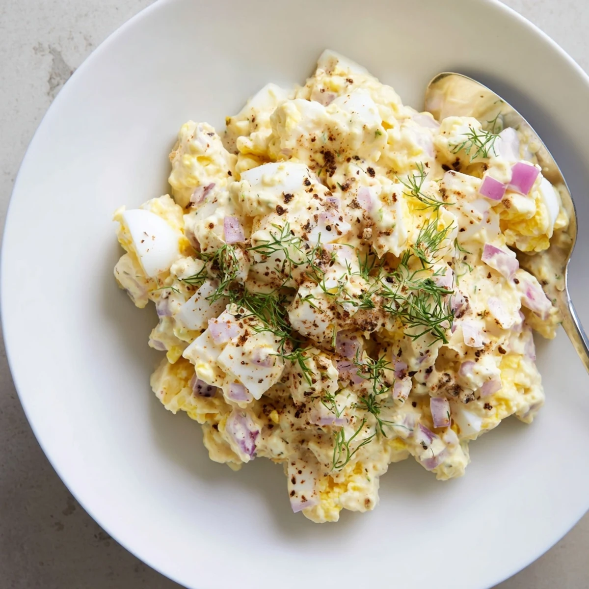 A chilled Classic Egg Salad Recipe piled in lettuce cups, crisp celery