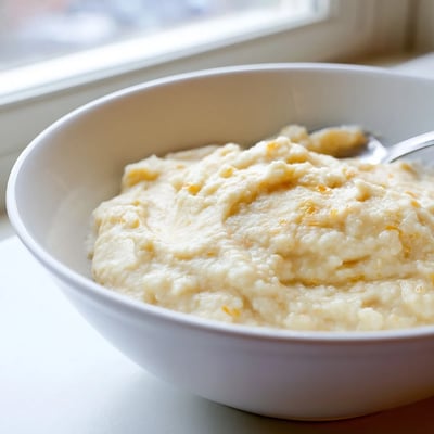 Golden-brown shepherds pie features tender cauliflower mash over hearty beef filling, perfect for a comforting meal.